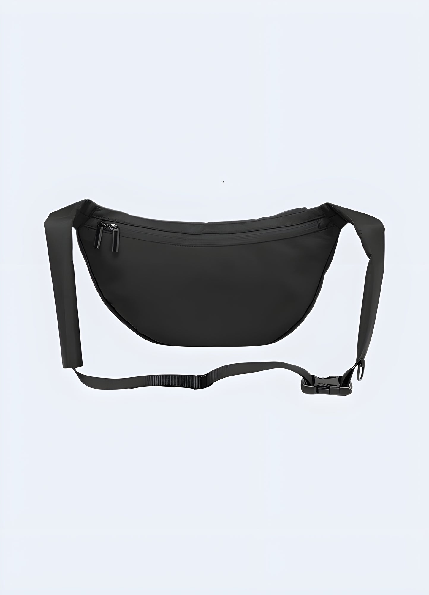 Back view of male model wearing black urban sling bag – adjustable strap across shoulder, ergonomic design and secure fit for urban mobility and techwear style.