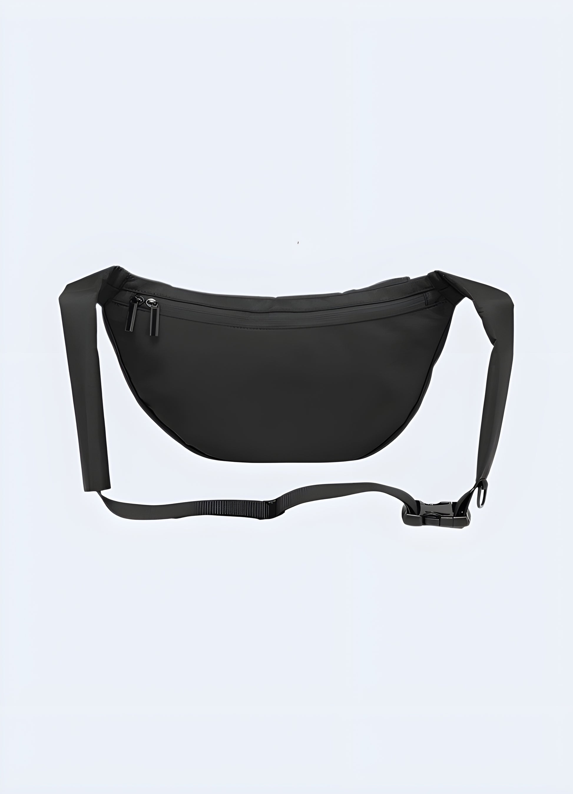 Back view of male model wearing black urban sling bag – adjustable strap across shoulder, ergonomic design and secure fit for urban mobility and techwear style.