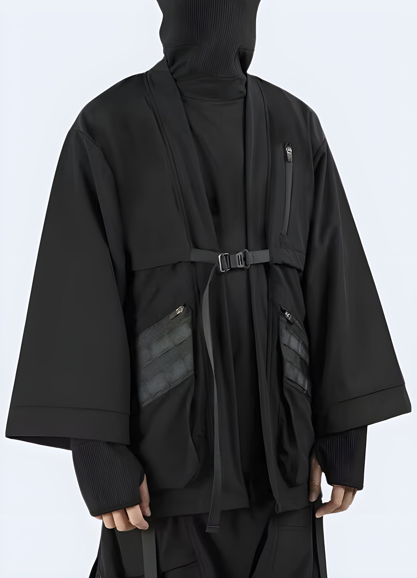 Wearing a long black kimono jacket, shown in full detail view to highlight its intricate design and traditional Japanese styling.