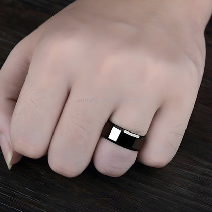 Woman wearing a black titanium ring, shown in a front view, highlighting the sleek and modern design of the ring.