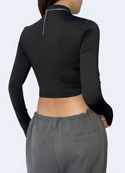 Back view of a woman wearing a sleek black turtleneck bodysuit, highlighting its form-fitting design and elegant simplicity. The clean lines of the bodysuit accentuate the silhouette, making it a go-to piece for UK fashion-forward individuals who appreciate a blend of subtlety and style.