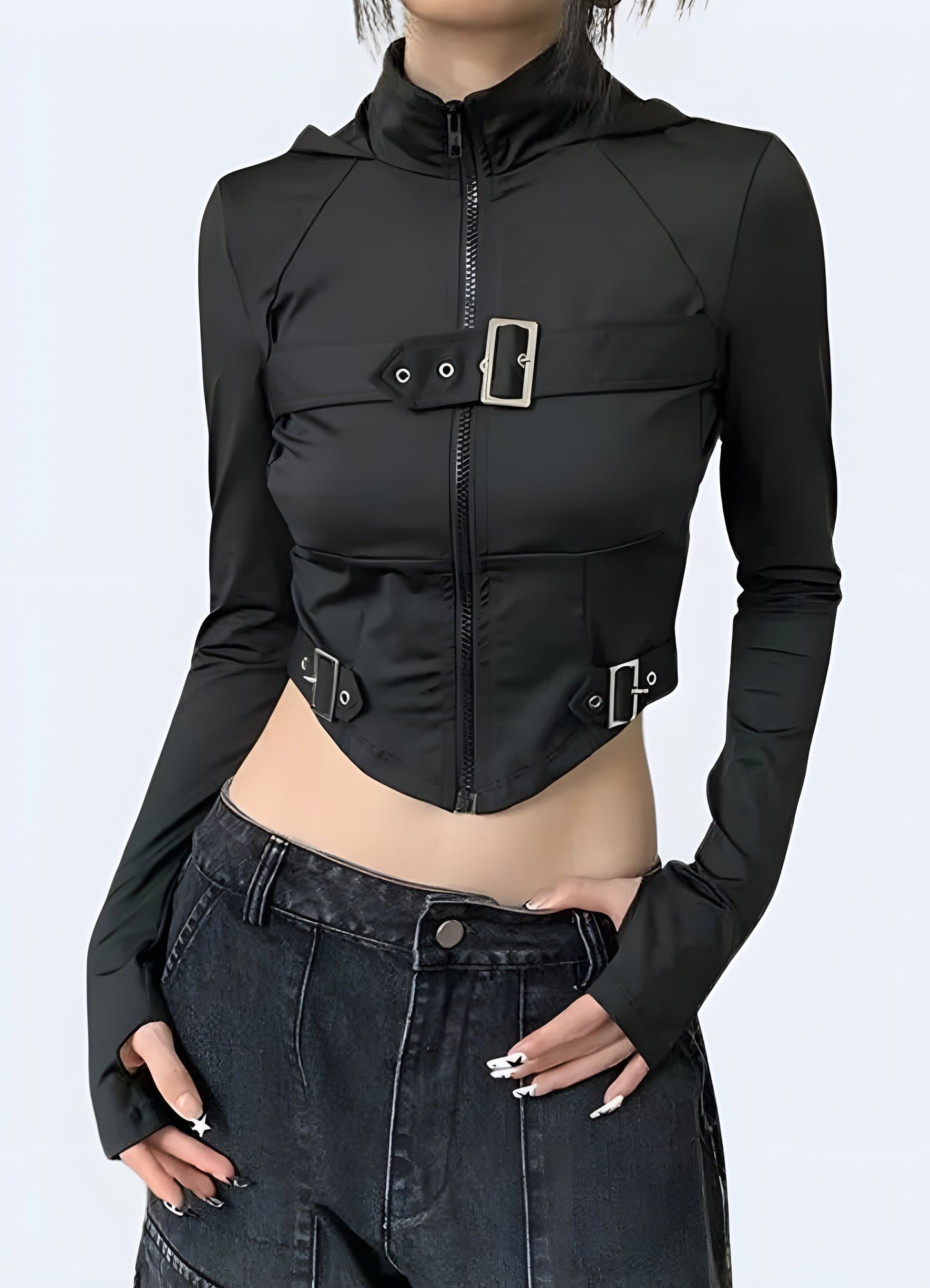 The streetwear crop top shines in its sleek black.