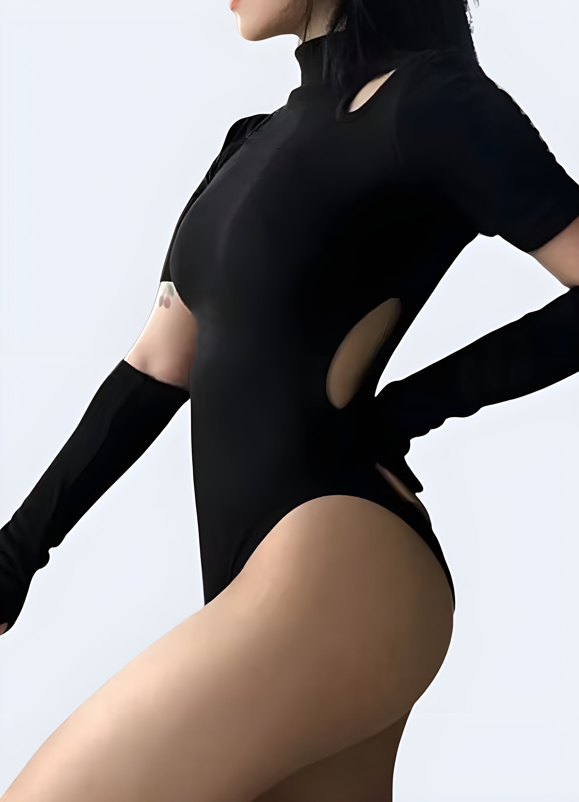 Side view of a women’s tactical bodysuit, featuring a streamlined fit and utility-inspired details. Perfect for bold urban fashion, combining comfort, confidence, and modern streetwear edge.