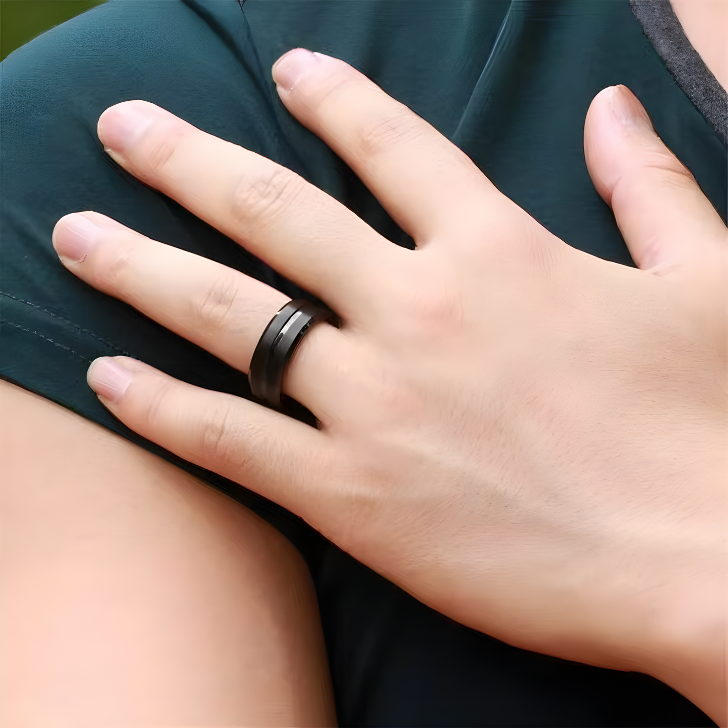 Woman wearing a techwear ring, shown in a front view to highlight its sleek, futuristic design and stylish details.